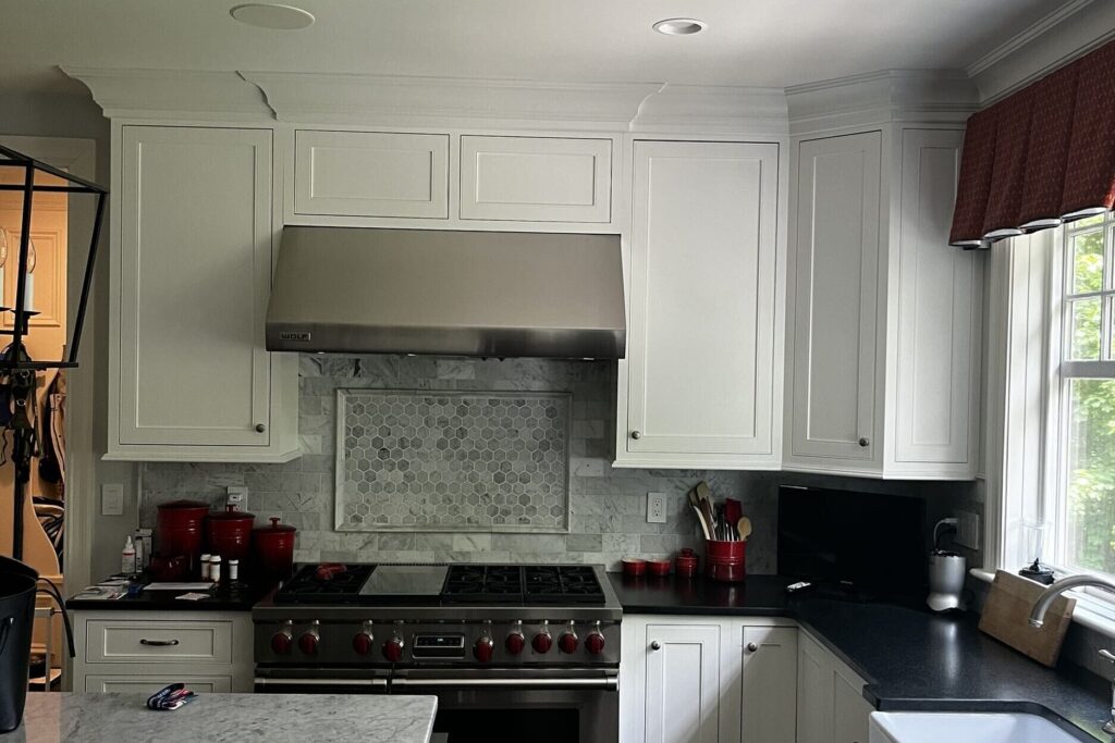 Wellesley interior refresh with hardwood floor and cabinet refinishing